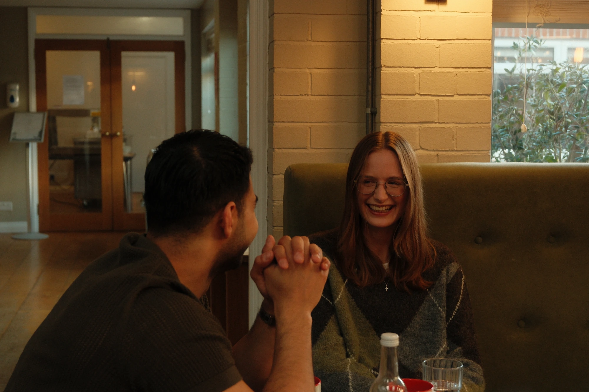 Two members of the church family talking over coffee