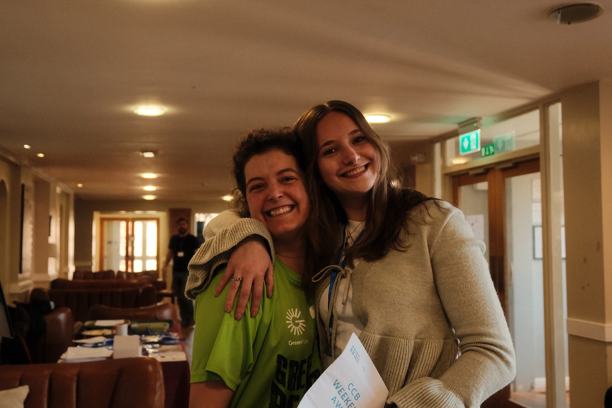 Two friends from the church family smiling together